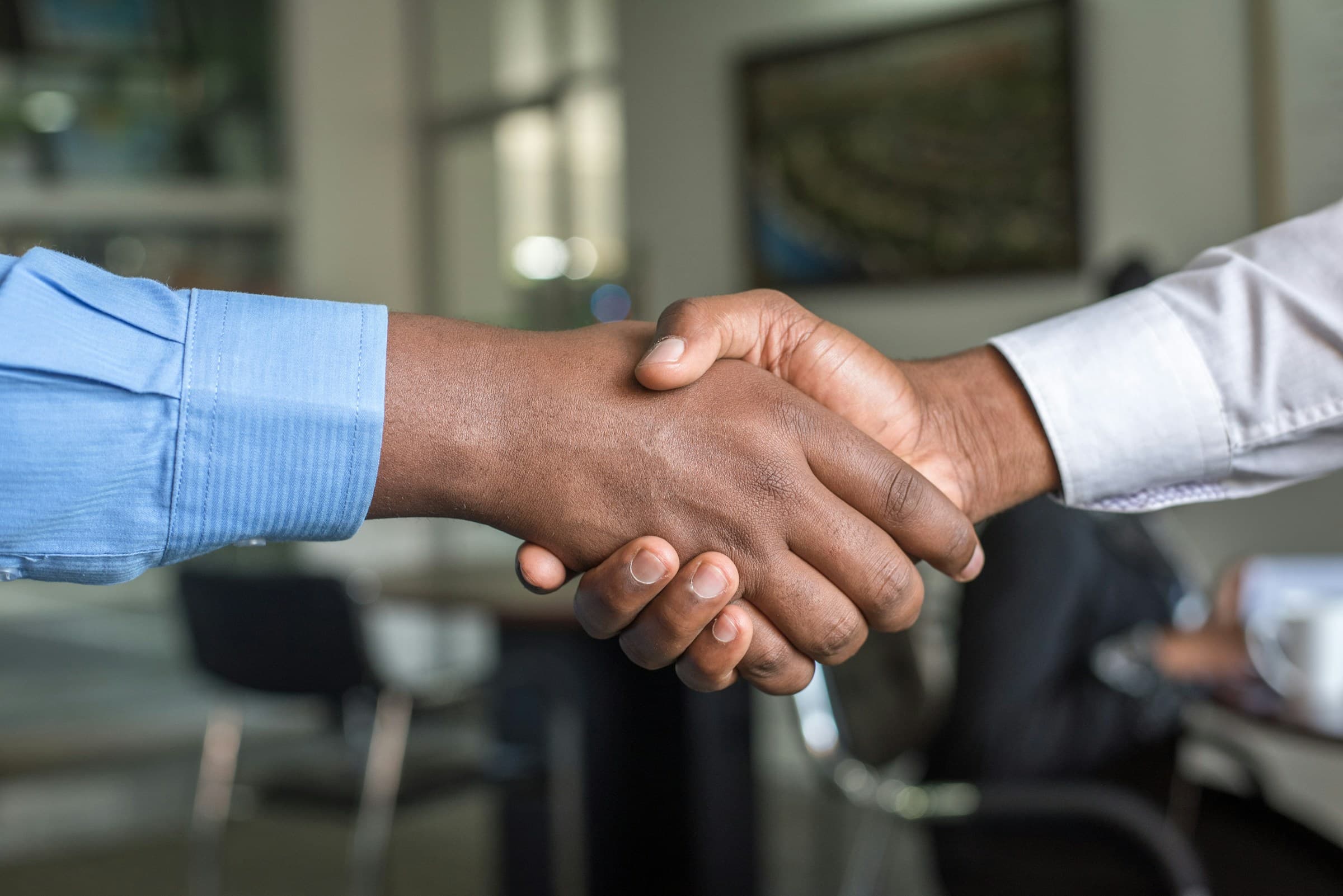 Client and team shaking hands